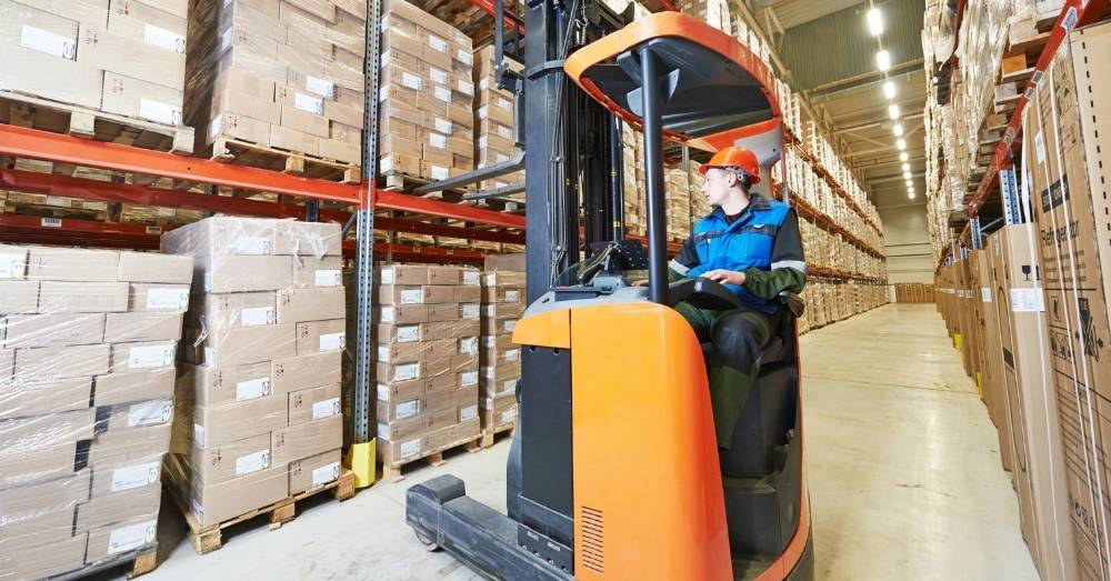 forklift operator arranging packages