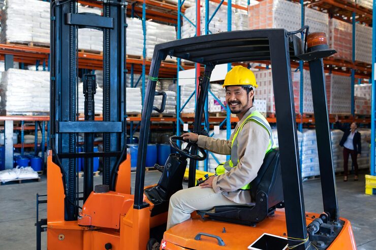 worker sitting forklift