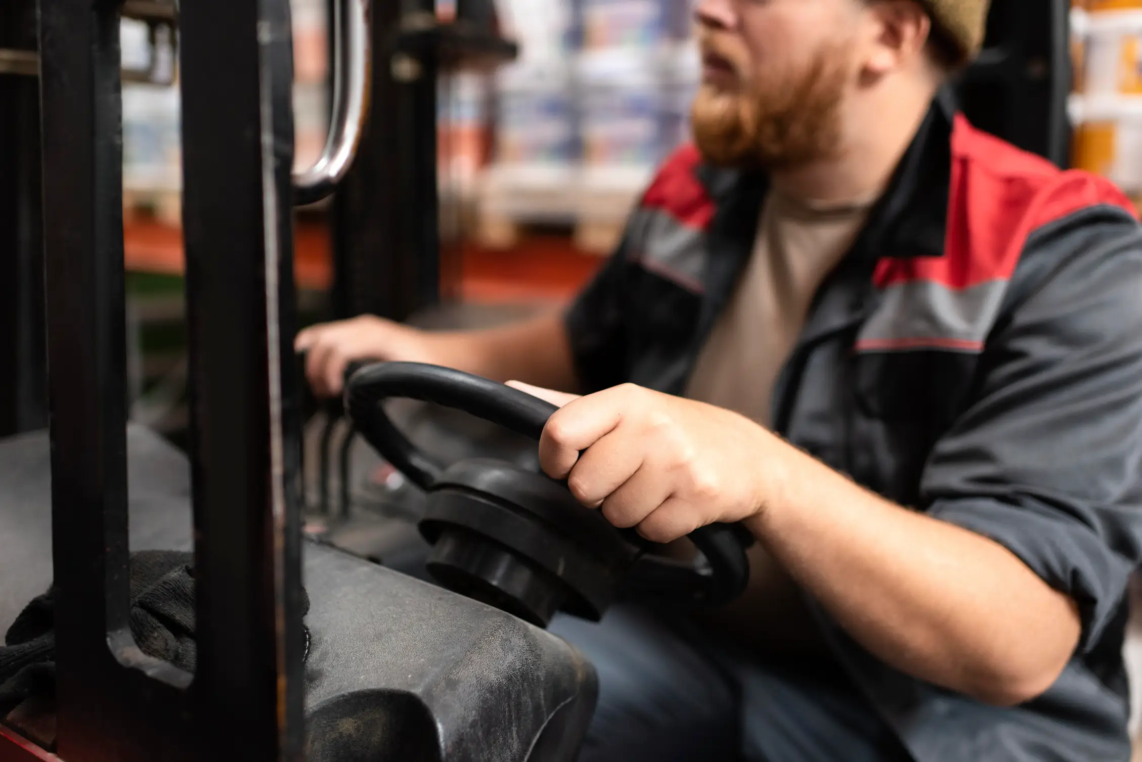 Close-up of a warehouse worker operating a forklift